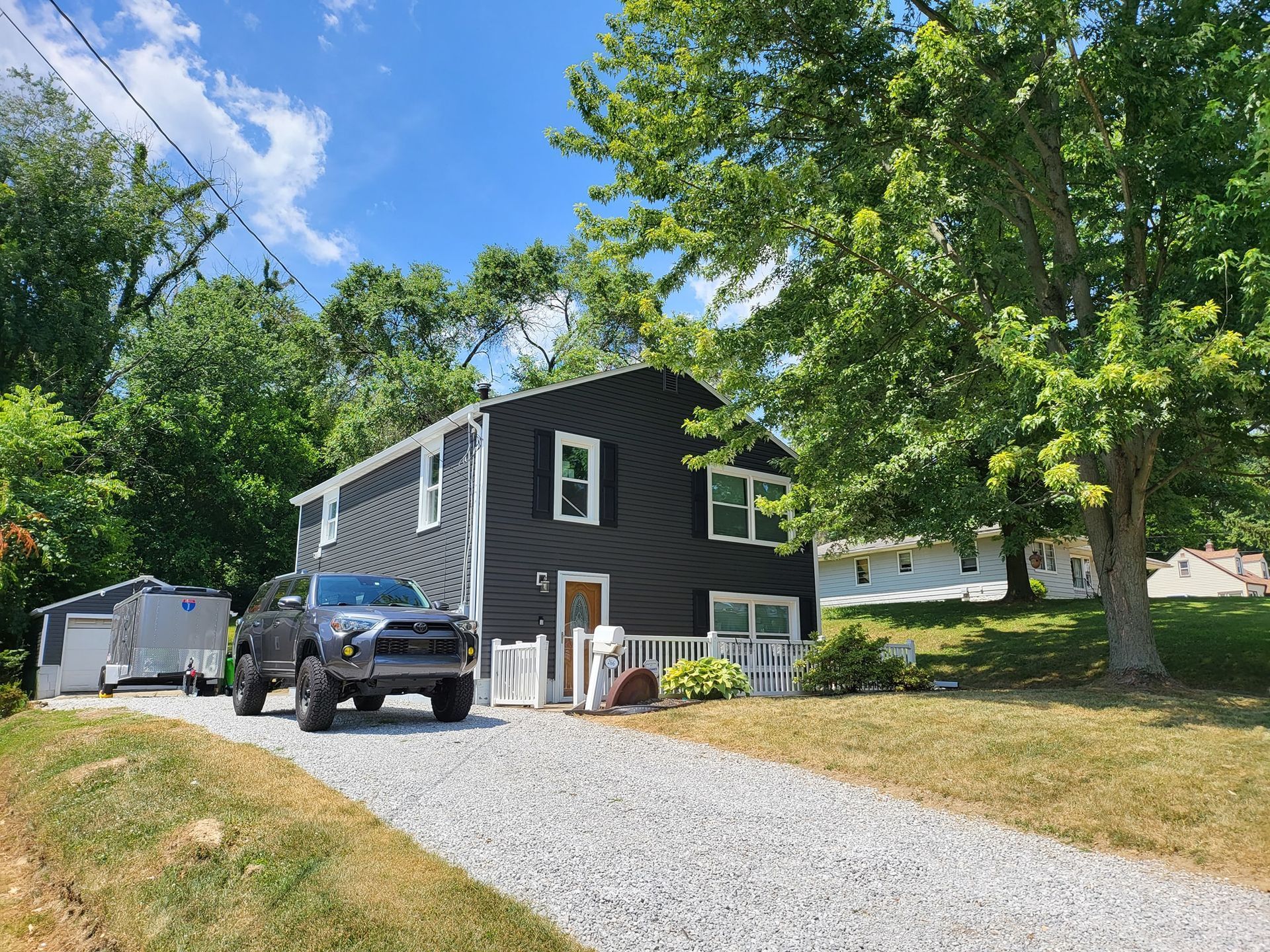 Completed exterior with new siding and roof in Barberton, Ohio