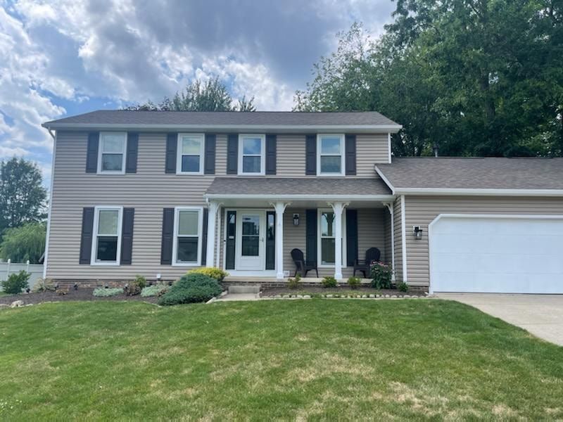 Dark siding and white-trim exterior transformation in Stow, Ohio